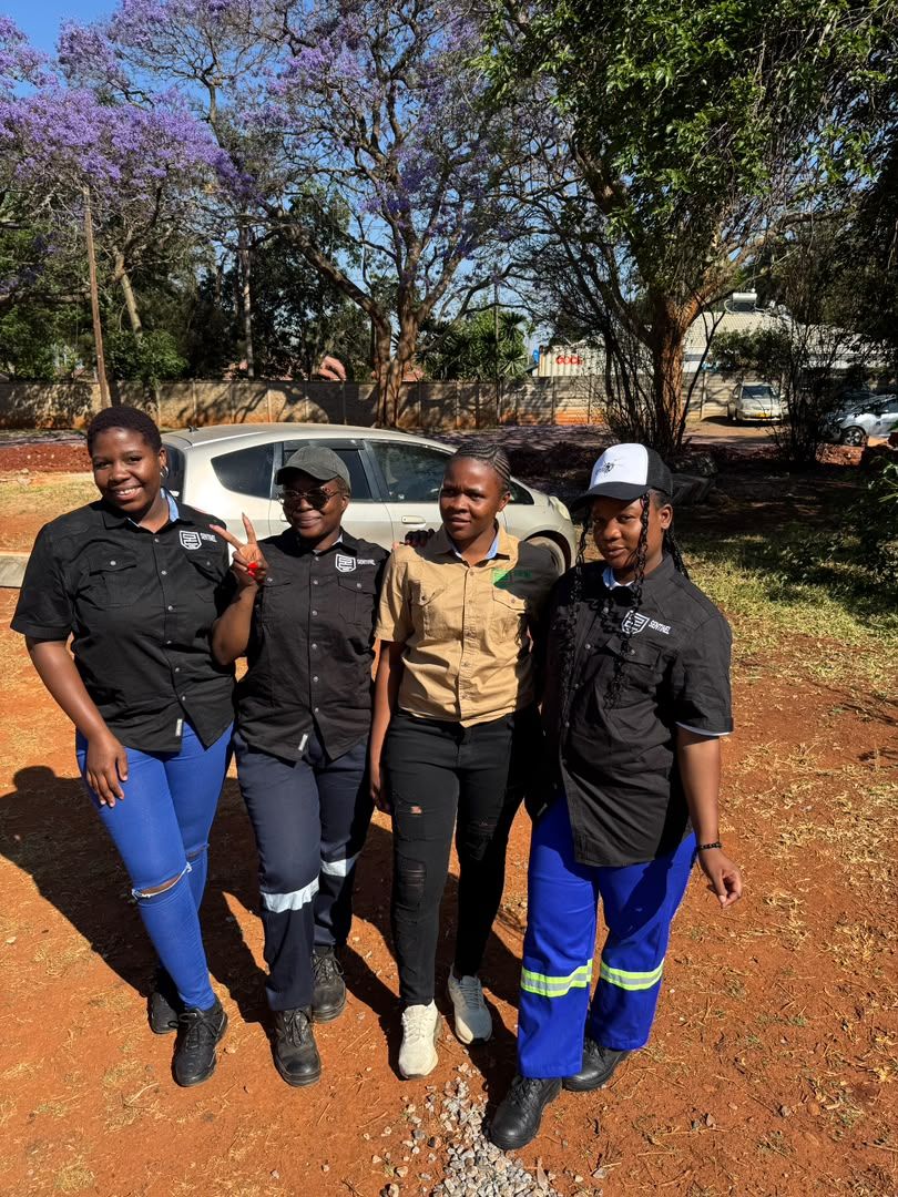 Four of the Sentinel team outside the office
