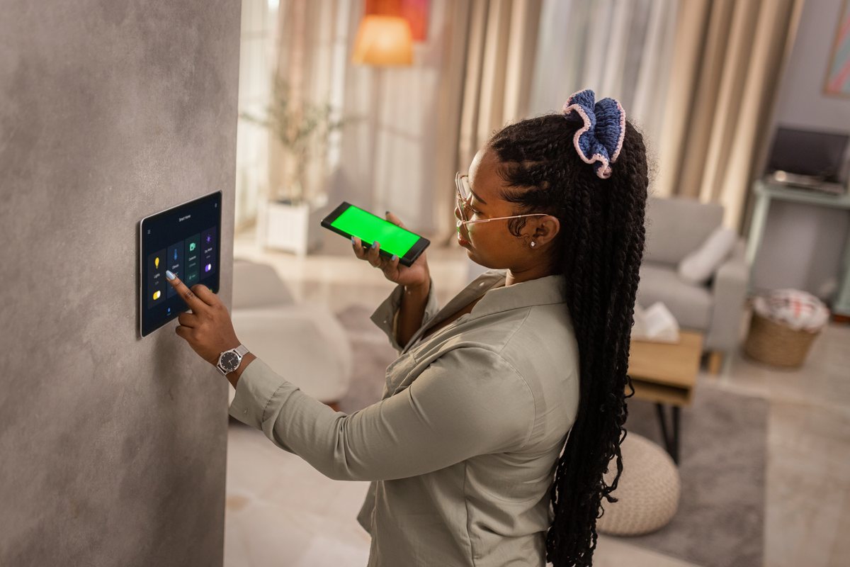 A smart home panel being set from a phone